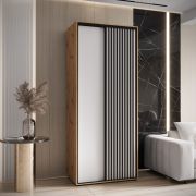 Schiebetürenschrank Mina 1,1 Meter breit in Weiß/Eiche, Front aus laminierter Platte, Anti Staubbürsten, schwarze Lamellen Optik, Metallgriffe in schwarz