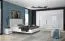 Großer Kleiderschrank | 7 Drehtüren | 4 Schubladen | 8 Fächer | mit 4 Kleiderstangen | 322 cm breit | Farbe: Weiß Abbildung