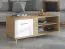 Stabiler Couchtisch mit zwei Türen Baka 04, drei Fächer, Farbe: Eiche Artisan / Weiß Hochglanz, ABS, MDF, Maße: 54 x 120 x 60 cm, modernes Design