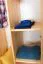 Kleiderschrank | 2 Drehtüren | 4 Fächer | mit Kleiderstange | 80 cm breit | Massivholz | Farbe: Natur Abbildung
