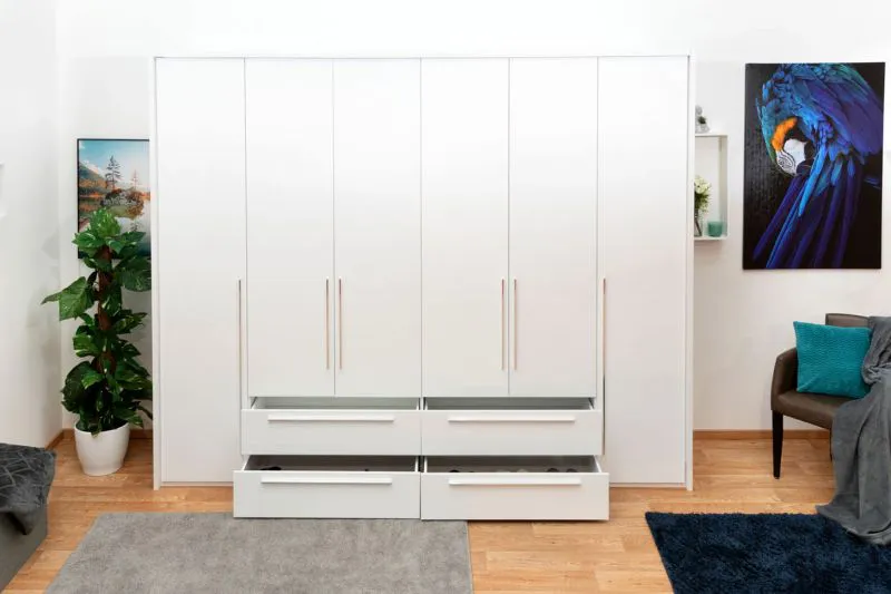 Kleiderschrank | 6 Drehtüren | 4 Schubladen | 8 Fächer | mit 4 Kleiderstangen | 277 cm breit | Farbe: Weiß Abbildung